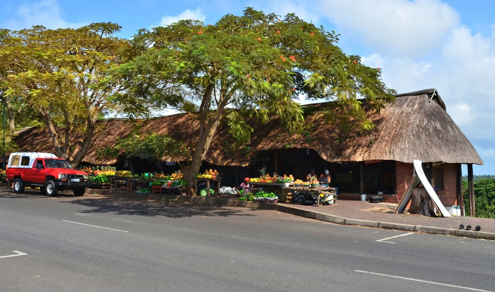 A busy community market near the Greater Kruger, produce stalls run by local traders